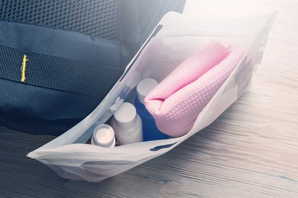 Toiletry bag with travel toiletries, small plastic bottle