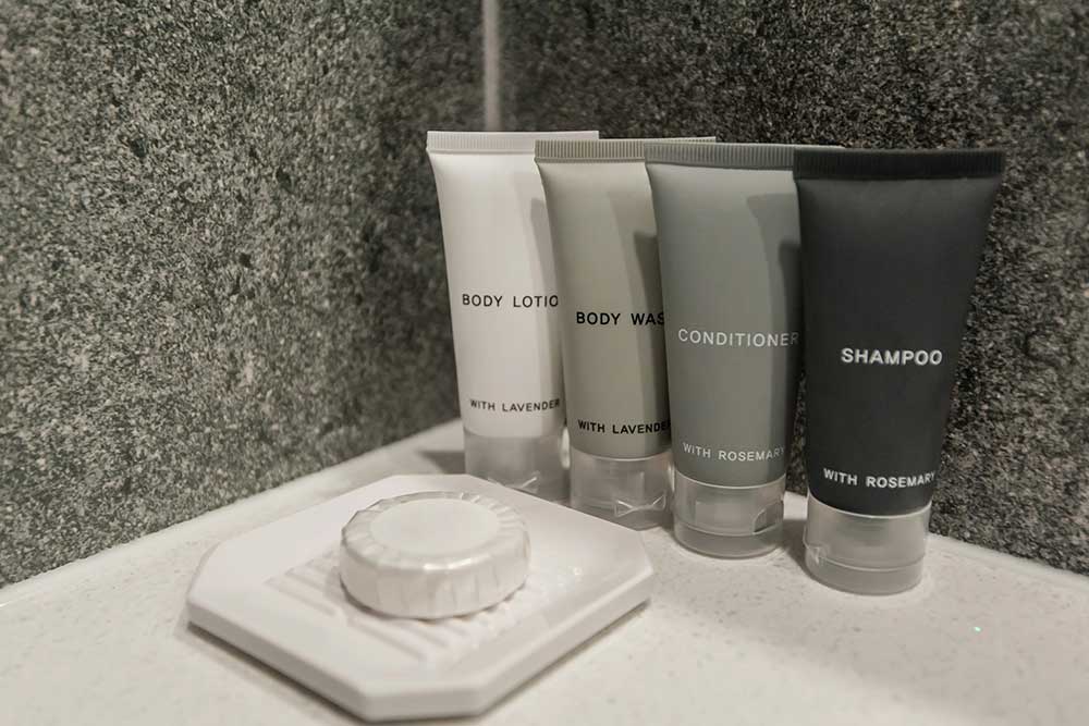 Toiletry bag with travel toiletries, small plastic bottle