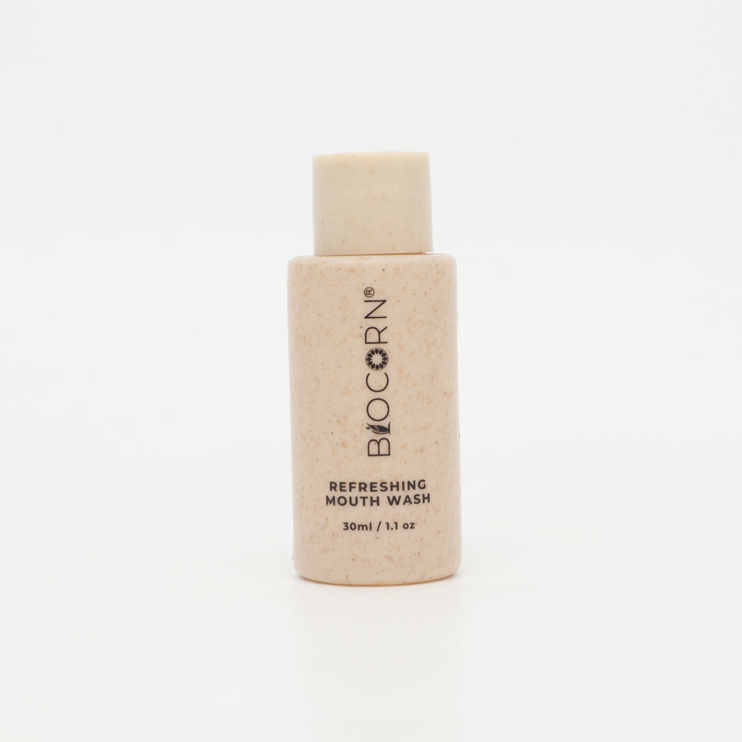 A 30ml bottle of BIOCORN Refreshing Mouth Wash, featuring a light beige