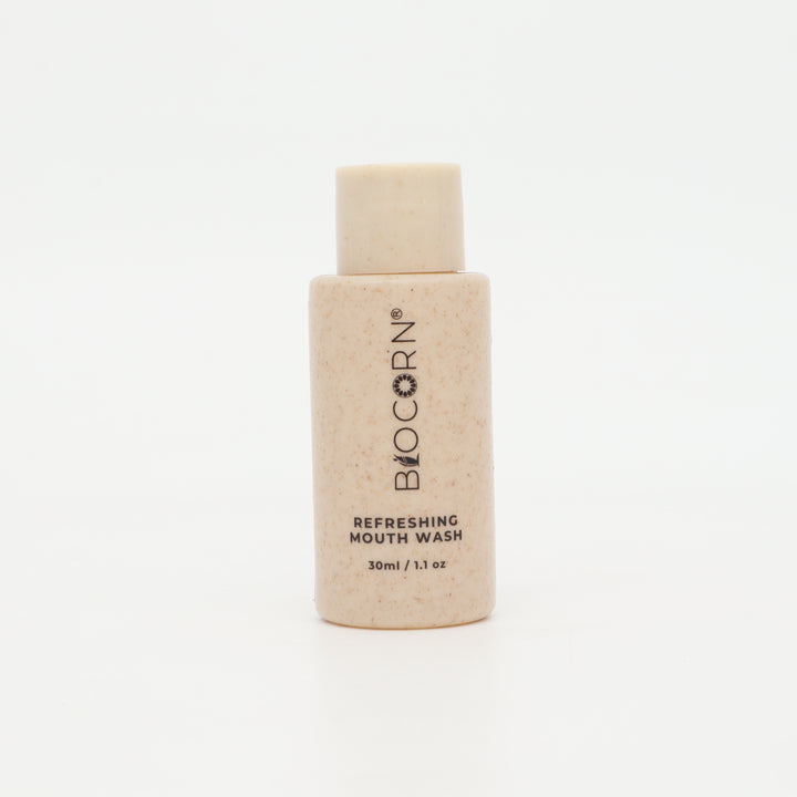 A 30ml bottle of BIOCORN Refreshing Mouth Wash, featuring a light beige