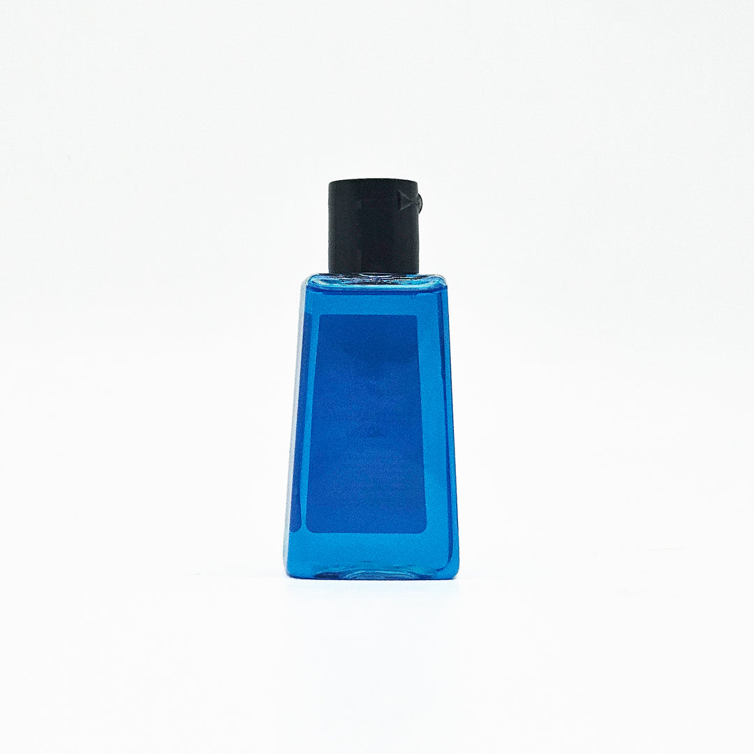 Blue bottle with black cap on a white background, dish detergent for sink