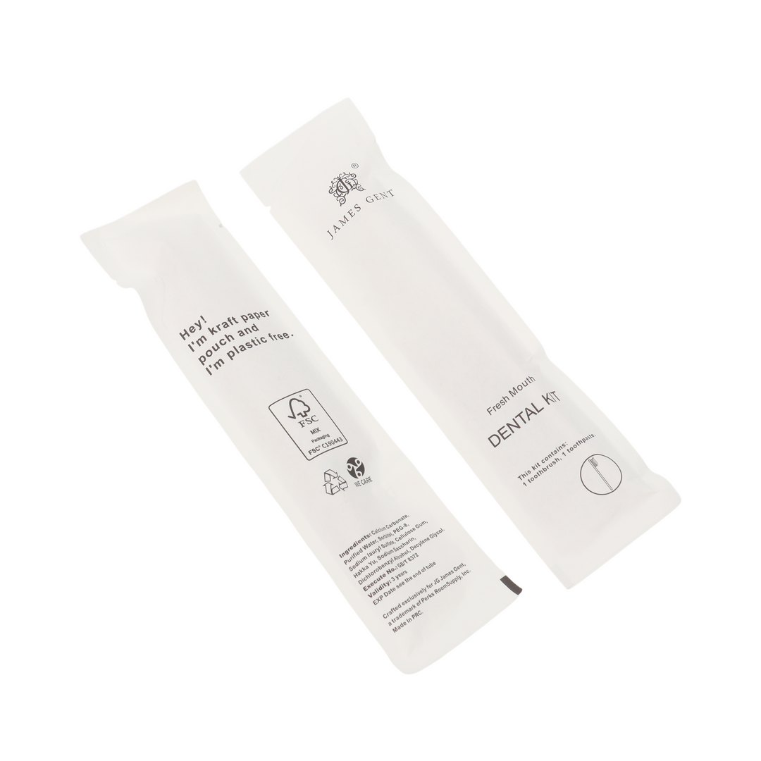 Two white paper dental kit packets from Jales Cout on a clean white background