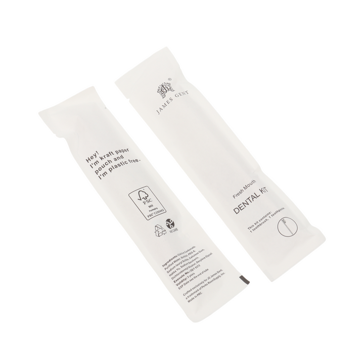 Two white paper dental kit packets from Jales Cout on a clean white background